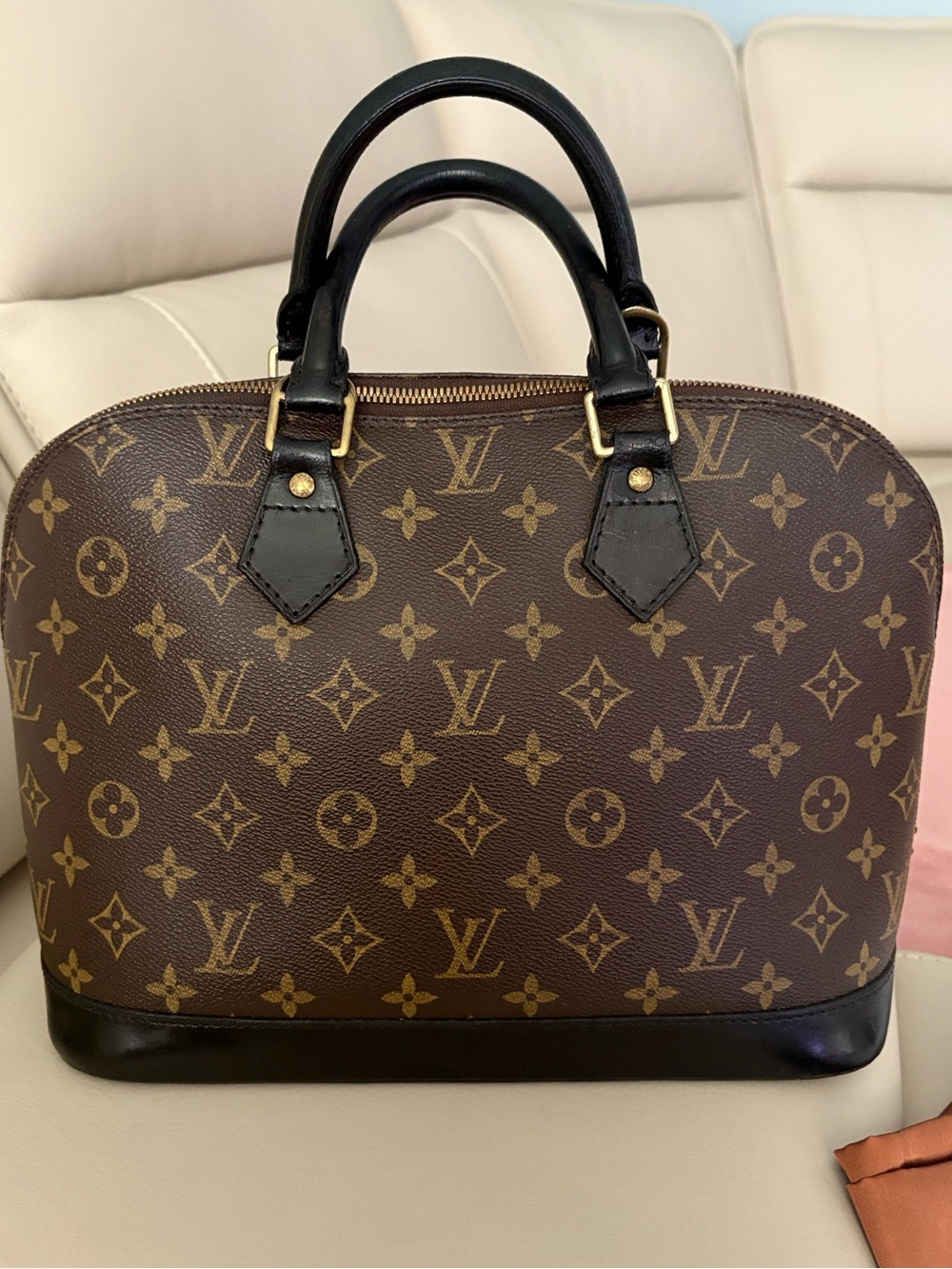 Louis Vuitton Monogram Canvas Alma in Brown with Black Trim